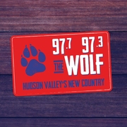 97.7/97.3 The Wolf logo